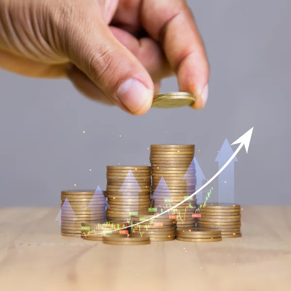 Hand in a coin with an arrow pointing upwards, symbolizing the growth of personal finances.