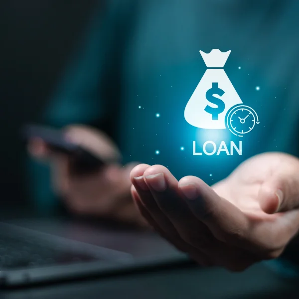 Image of a laptop displaying a money bag and money sign, symbolizing loans available 24/7.